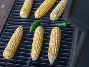 grilling fresh corn on the cob and jalapenos