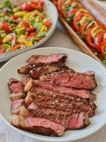 RIBEYE WITH HALLOUMI CAPRESE & SHISHITO CORN SALAD