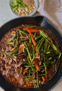 top sirloin steak stir fry in pan